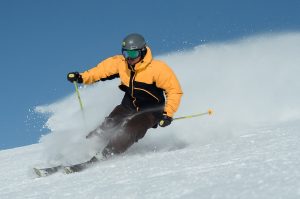 Man skiing down a snowy mountain