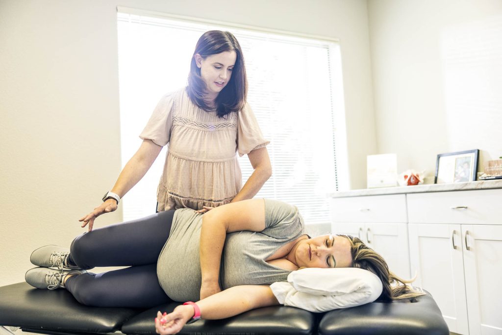 Dr. Sarah Martinez, DPT works with a prenatal patient